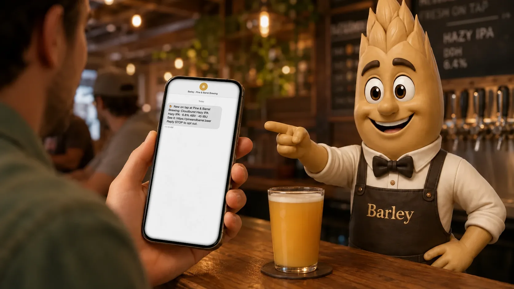 A guest holds up a phone with a Release Radar text from Barley, new on tap at Pine & Barrel Brewing: Cloudburst Hazy IPA, while Barley points to it from behind the bar.