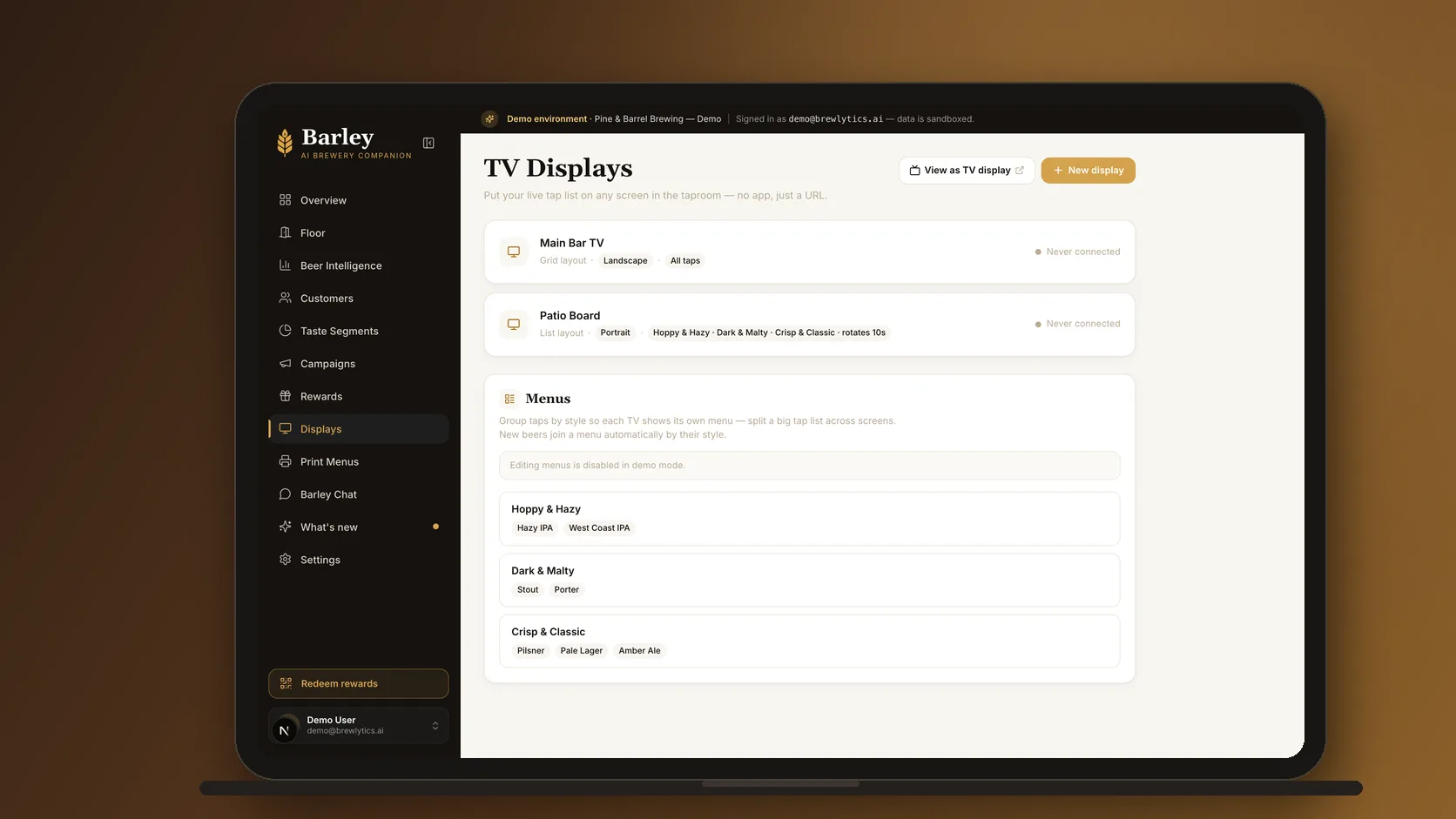 The Brewlytics TV Displays page on a laptop: the main bar TV and patio board, each with its menu, and the menu groups they draw from.
