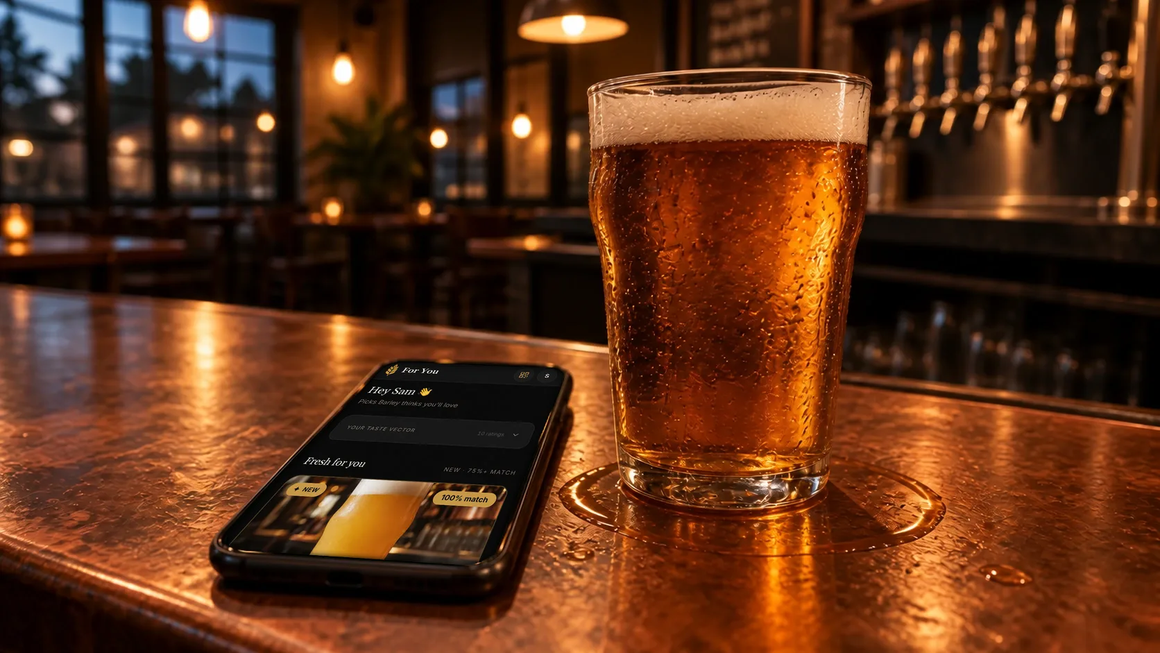 A phone on a copper bar next to a pint shows the Barley app's For You screen, with a Fresh for you list of beers that just arrived.
